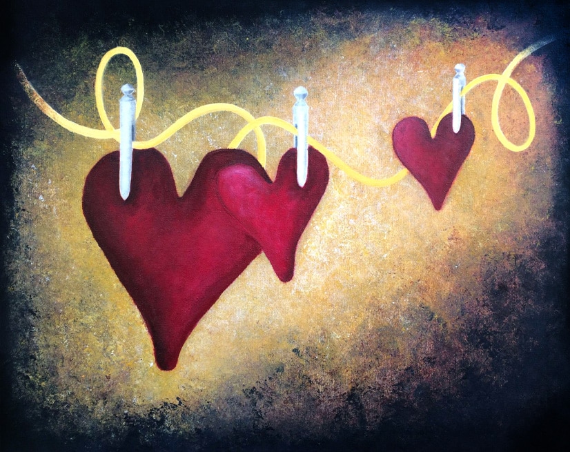 Red hearts hanging on a yellow string, symbolizing love, connection, and emotional ties.