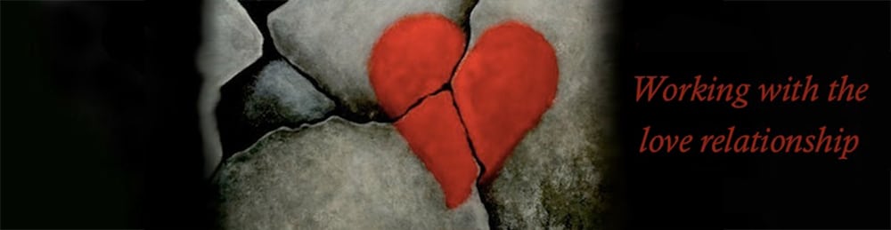Cracked stone with a red heart symbol, symbolizing emotional healing and relationship work, with text 'Working with the love relationship'.