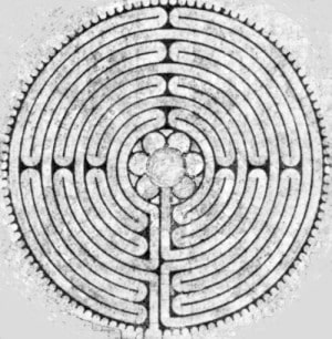 Black and white mandala with intricate circular labyrinth design, symbolizing introspection and spiritual journey.